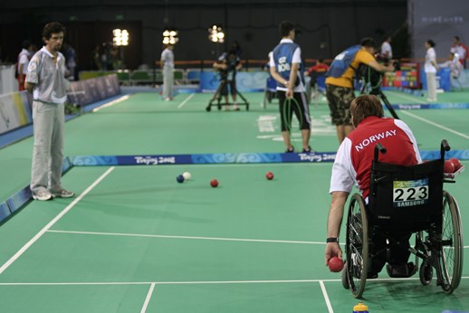 man in wheelchair playing bocce ball