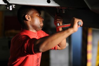 man working under a car